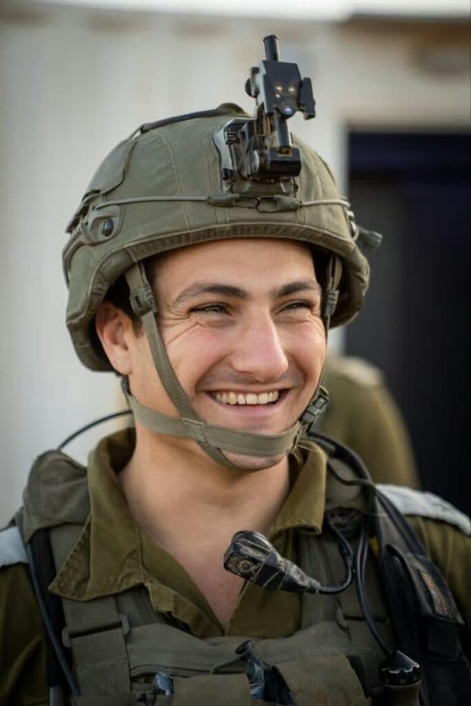 Dor Ben Simchon smiling while wearing an IDF helmet and uniform