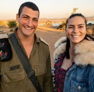 Dor Ben Simchon and his wife Ariel smiling together outdoors