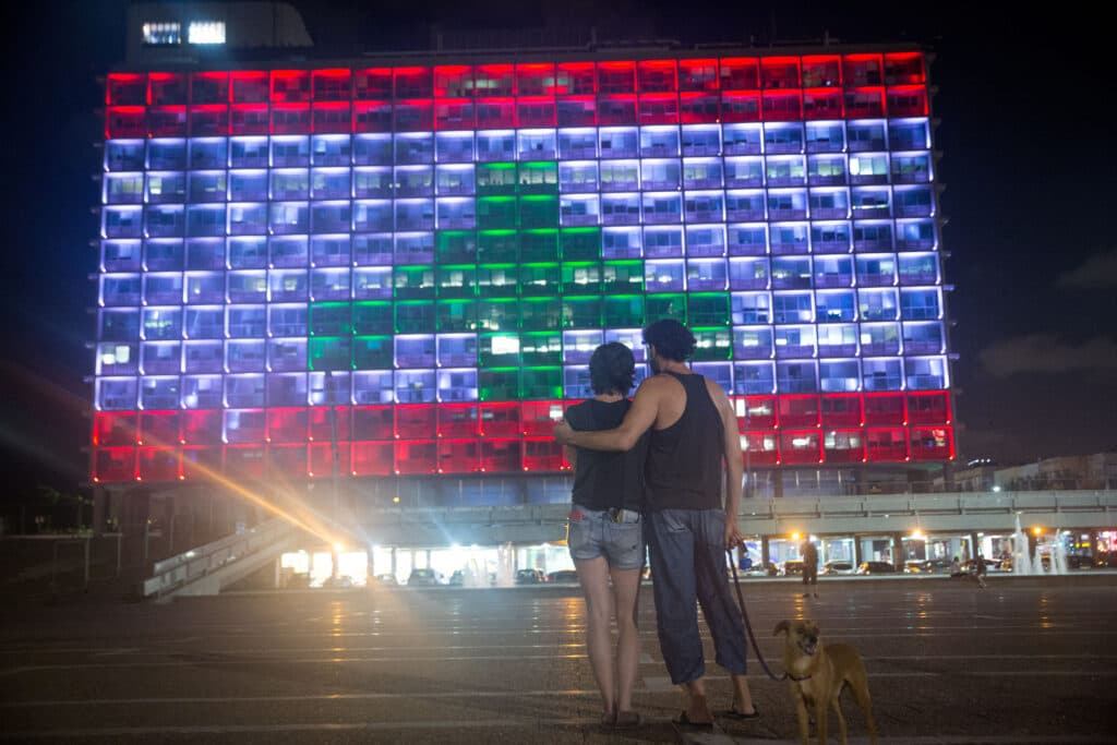 Tel Aviv City Hall lit with the colors of the Lebanese flag.