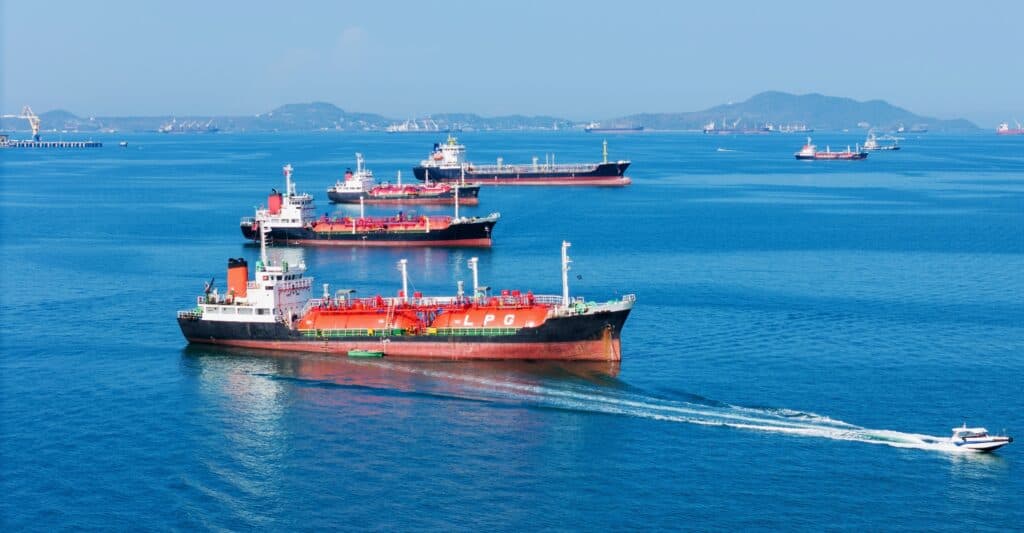 Tankers moving through open water near a shipping route.