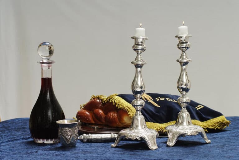 Customary Sabbath table: challah, candles, and wine