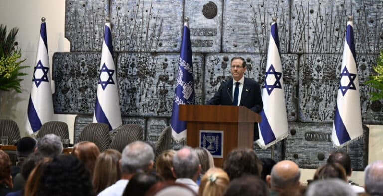 President Isaac Herzog speaks at a ceremony marking the 85th anniversary of the Farhud at the President’s Residence in Jerusalem.