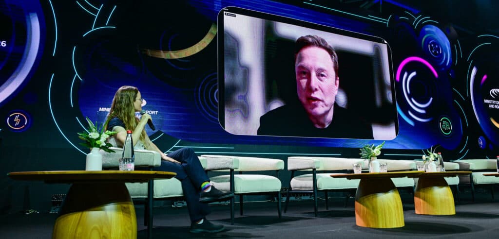 Elon Musk appears on a screen during the Smart Mobility Summit in Tel Aviv.