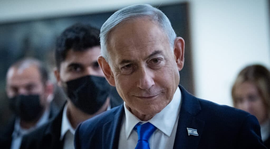 Prime Minister Benjamin Netanyahu walks outside his office at the Knesset in Jerusalem.