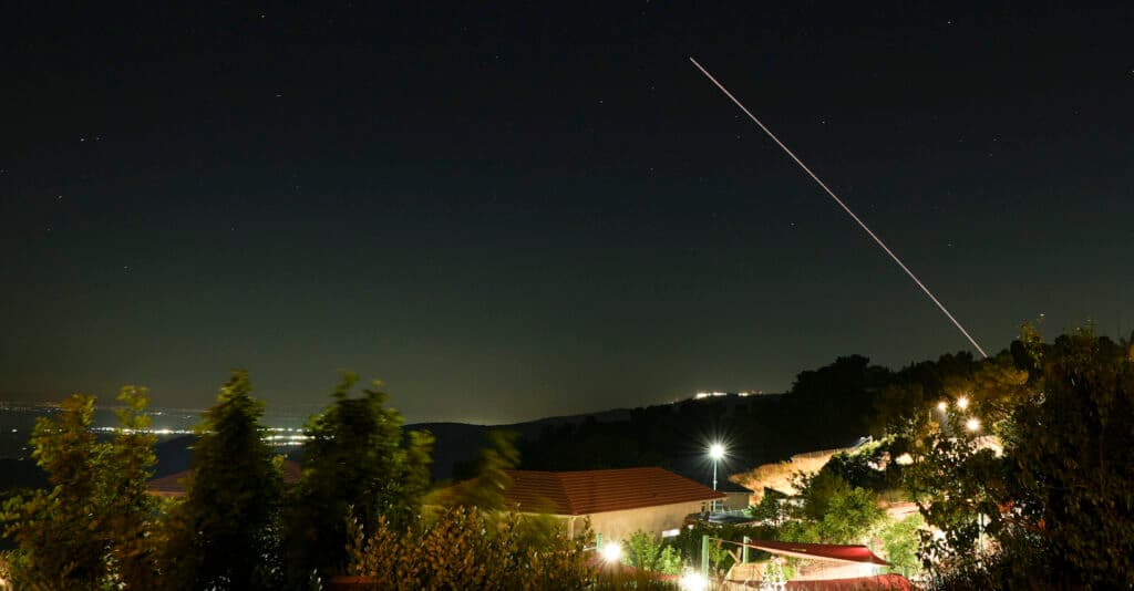 A missile interception trail is seen in the night sky over Israel.