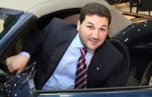 Nadim Gemayel seated inside a car at an event in Lebanon.