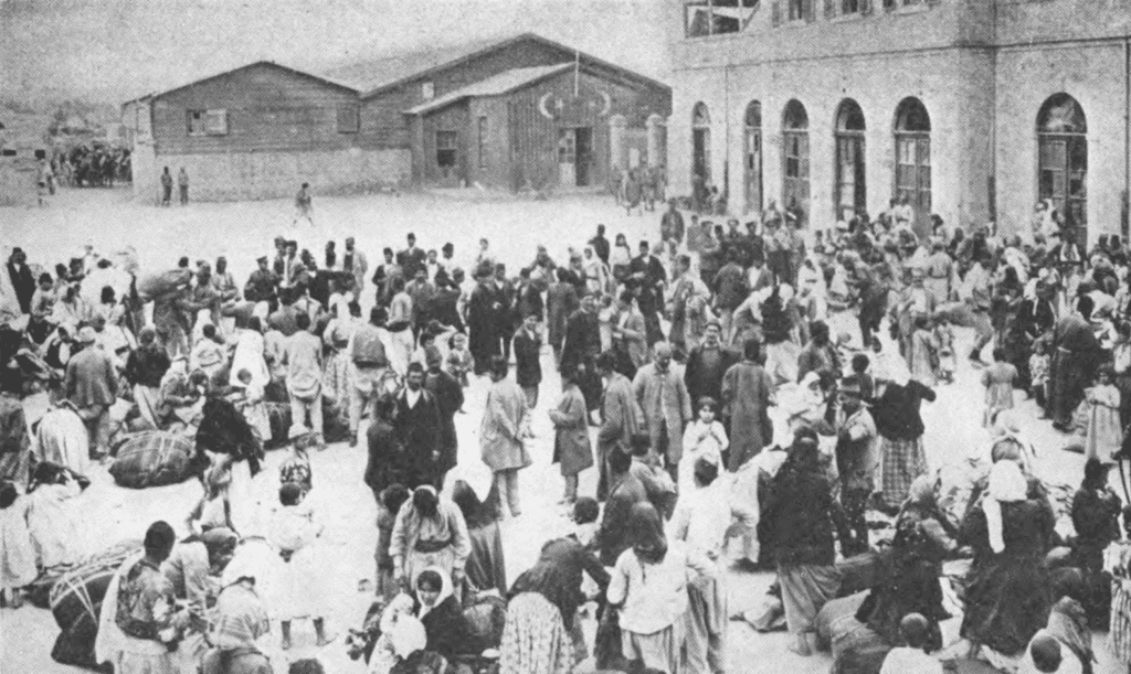 Armenian civilians gathered outside buildings during the Armenian genocide period.