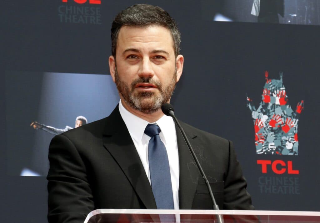 Jimmy Kimmel speaking at a podium during a public event