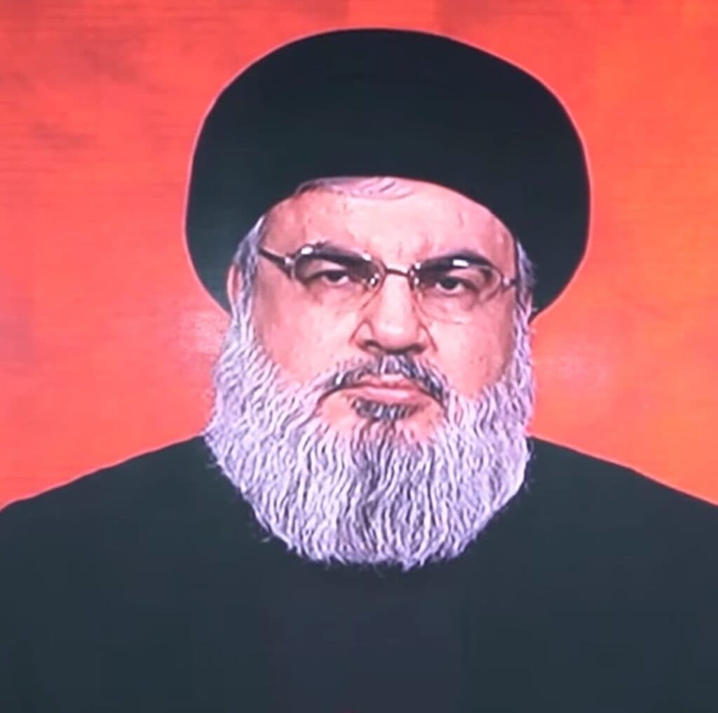 Hassan Nasrallah appears on a large screen during an event in Beirut, Lebanon.