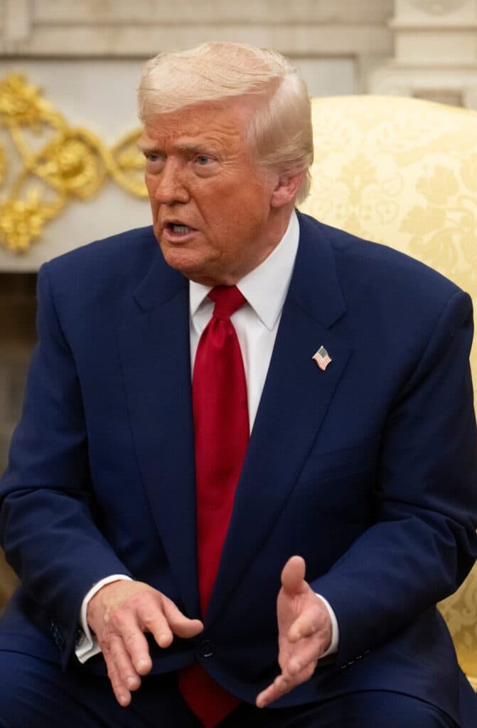 President Donald Trump speaking during a meeting in the Oval Office.