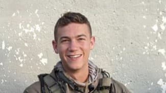 yosef guedalia sitting in uniform