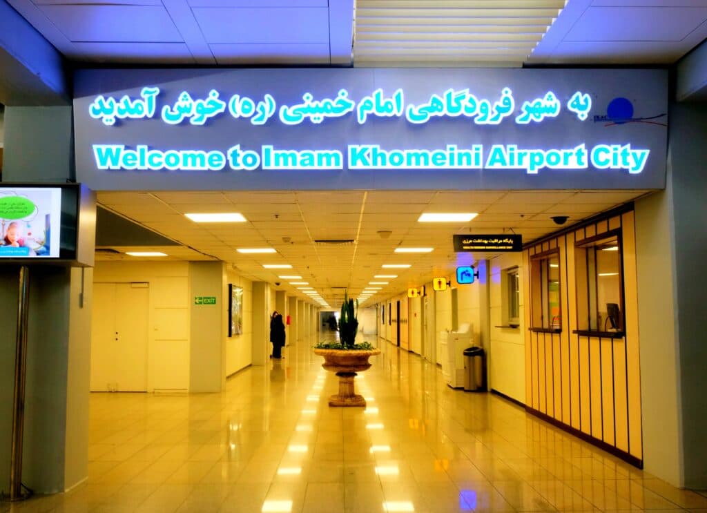 Welcome sign at Imam Khomeini Airport City in Tehran as Iran flight restrictions expand under U.S. sanctions.